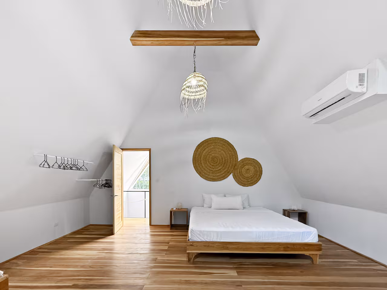 Bedroom with natural wood finishes at Crystal Jungle Villa