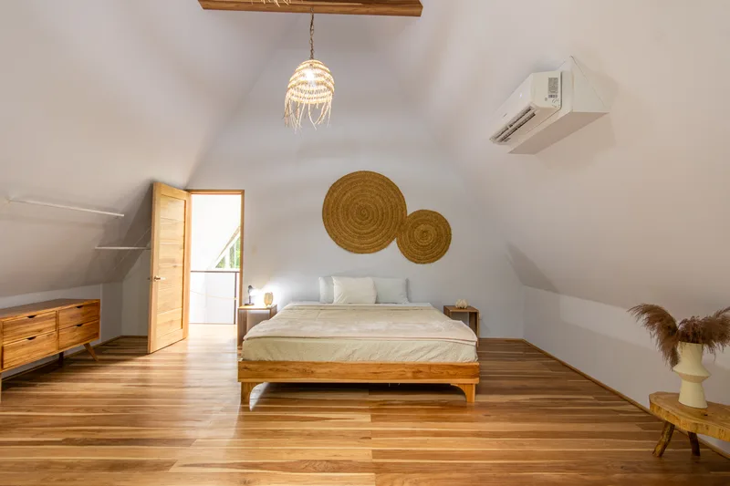 Crystal Jungle Villa loft bedroom with A-frame vaulted ceiling and king bed
